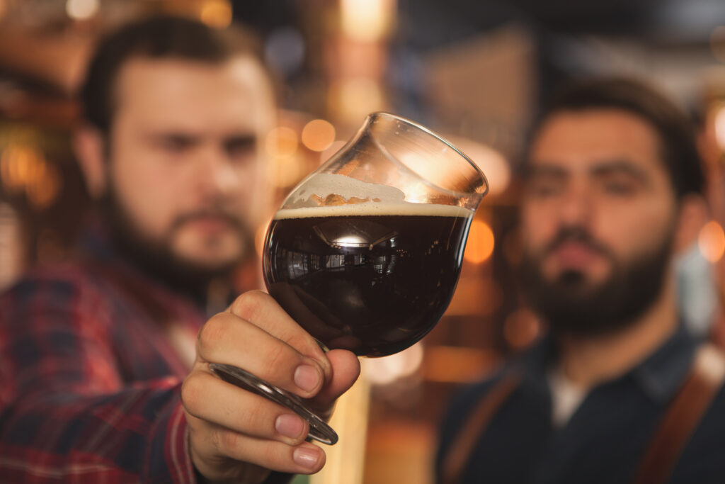 Two professional brewers working on their craft beer recipe